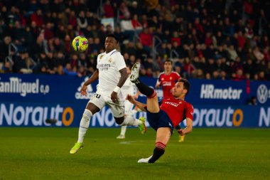 Madrid, Spain- February 18, 2023: League match between Real Madrid and Osasuna in Pamplona. Vinicius Jr. fighting for the ball. Football games. Real Madrid player.
