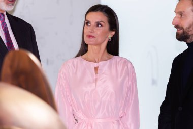 Madrid, Spain- February 23, 2023: The King and Queen of Spain inaugurate the ARCO art fair, in Madrid. Queen Leticia wears a pastel-colored dress and a bag with floral decoration.