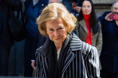 Madrid, Spain- March 3, 2023: Queen Emeritus Sofa visits the church of Cristo de Medinacelli in Madrid. The queen greets the people waiting for her arrival at the church.