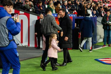 Madrid, Spain- March 4, 2023: Diego Pablo Simeone receives the support of his family on the field before the game. Simeone says goodbye to Atletico. Football coach. Match records.