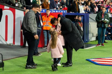 Madrid, Spain- March 4, 2023: Diego Pablo Simeone receives the support of his family on the field before the game. Simeone says goodbye to Atletico. Football coach. Match records.