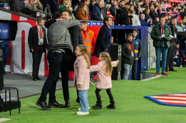 Madrid, Spain- March 4, 2023: Diego Pablo Simeone receives the support of his family on the field before the game. Simeone says goodbye to Atletico. Football coach. Match records.