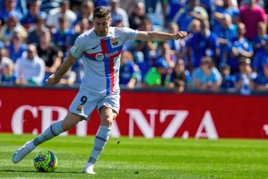 Madrid, Spain- April 16, 2023: Soccer match between F.C Barcelona and Getafe C.F. Professional soccer. Contact sport. Spanish league champion. Barcelona players. clipart