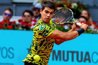 Madrid, Spain- April 28.2023: Tennis match at the Mutua Madrid Open between Carlos Alcaraz and Emil Ruusuvuori with the victory of the Spanish. ATP match. Number 2 in the ATP ranking. clipart