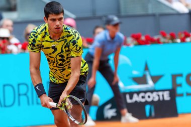 Madrid, Spain- April 28.2023: Tennis match at the Mutua Madrid Open between Carlos Alcaraz and Emil Ruusuvuori with the victory of the Spanish. ATP match. Number 2 in the ATP ranking. clipart