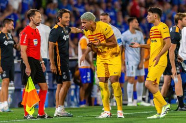 Madrid, Spain- August 13, 2023: Soccer match between Getafe FC and Barcelona FC of the Spanish EA Sports league. Ronald Araujo with the ball. Football players. clipart