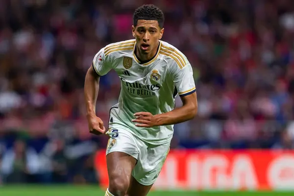 stock image Madrid, Spain- September 24, 2023: League match between Atletico de Madrid and Real Madrid. Jude Bellingham with the ball. Football players. Victory for Atletico de Madrid.