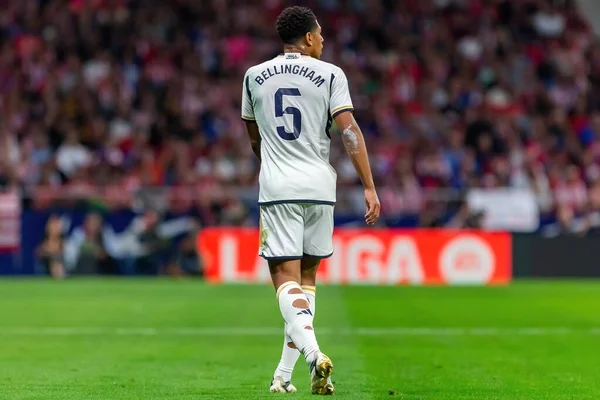 stock image Madrid, Spain- September 24, 2023: League match between Atletico de Madrid and Real Madrid. Jude Bellingham with the ball. Football players. Victory for Atletico de Madrid.