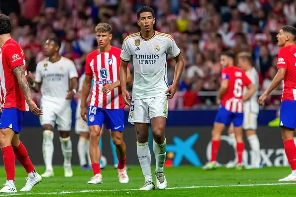 stock image Madrid, Spain- September 24, 2023: League match between Atletico de Madrid and Real Madrid. Jude Bellingham with the ball. Football players. Victory for Atletico de Madrid.