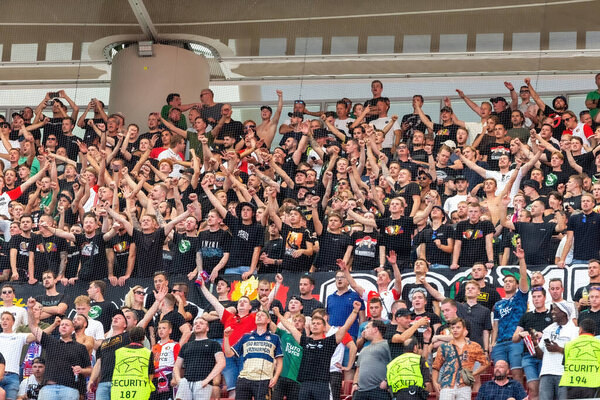 Madrid, Spain- October 4, 2023: Champions League match between Atletico de Madrid and Feyenoord played in Madrid. Ultra Feyenoord fans cheering on their team in the stands.