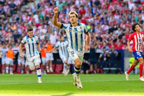 stock image Madrid, Spain- October 8, 2023: League match between Atletico de Madrid and Real Sociedad played at the Metropolitano in Madrid. Oyarzabal celebrates a goal. Professional soccer players.