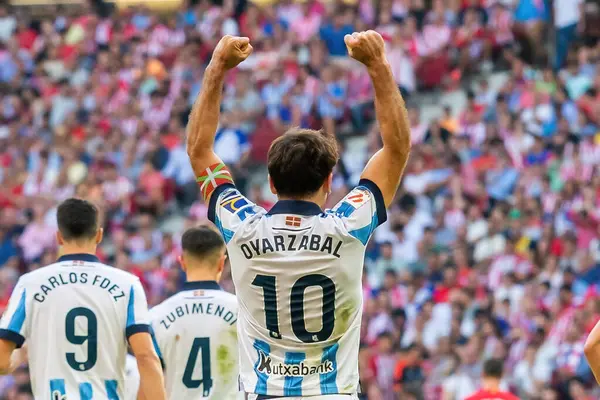 stock image Madrid, Spain- October 8, 2023: League match between Atletico de Madrid and Real Sociedad played at the Metropolitano in Madrid. Oyarzabal celebrates a goal. Professional soccer players.