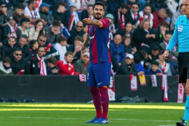 Madrid, Spain- November 25, 2023: League match between Rayo Vallecano and F.C Barcelona in Madrid. Gundogan with the ball. Football players. clipart