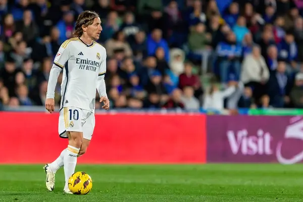 stock image Madrid, Spain- February 1, 2024: League match between Getafe f.c and Real Madrid played in the capital. Luka Modric with the ball. Football players.