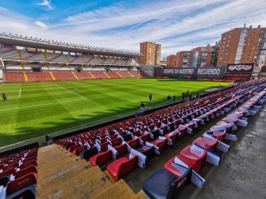 Madrid, Spain- February 18, 2024: Rayo Vallecano fans fight so that their soccer stadium is not destroyed. Rayo Vallecano forced to change its soccer stadium due to lack of security. clipart