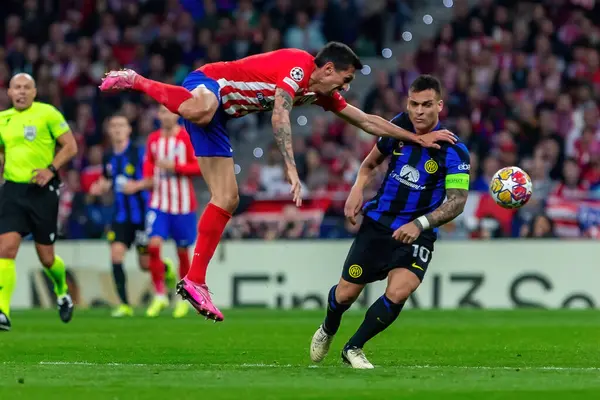 stock image Madrid, Spain- March 13, 2024: Round of 16 match between Atletico Madrid and Inter Milan. Lautaro Martinez with the ball. Argentine player. .