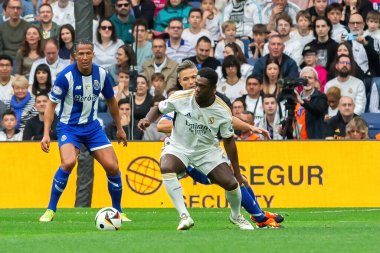 Madrid, Spain- March 23, 2024: Solidarity match between Real Madrid Leyendaa and Porto Vintage at the Santiago Bernabeu. Real Madrid legends meet in a macht classic soccer match clipart