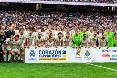 Madrid, Spain- March 23, 2024: Solidarity match between Real Madrid Leyendaa and Porto Vintage at the Santiago Bernabeu. Real Madrid legends meet in a macht classic soccer match clipart