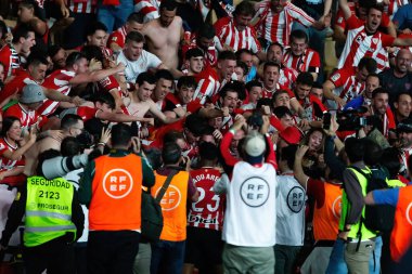 Seville, Spain- April 6, 2024: Final of the Copa del Rey soccer match between Athletic Club de Bilbao and Real Mallorca. The Athletic players celebrate the victory. clipart
