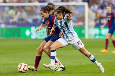 Zaragoza, Spain- May 18, 2024: Final of the Queen's Cup of women's soccer played in Zaragoza between F.C Barcelona and Real Sociedad. Victory for the Catalan team. Soccer players. clipart