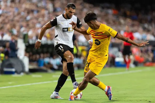 stock image Valencia, Spain - August 17, 2024: League match between Valencia F.C and Barcelona F.C. Victory of the Catalan team. Professional soccer players.