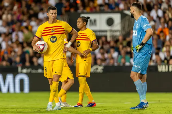 stock image Valencia, Spain - August 17, 2024: League match between Valencia F.C and Barcelona F.C. Barcelona players. Professional football players.