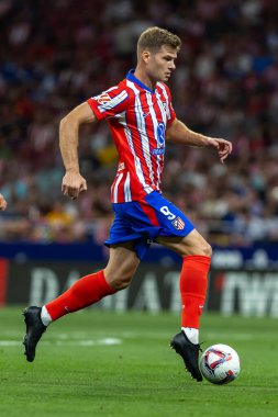 Madrid, Spain - August 25, 2024: League match between Atletico de Madrid and Girona f.c. Liga 2024, 2025. Atletico de Madrid players. Professional football. Spanish football league. clipart