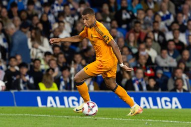 San Sebastian, Spain - September 14, 2024: League match between Real Sociedad and Real Madrid, played in San Sebastian. Kylian Mbappe with the ball. Real Madrid players. clipart