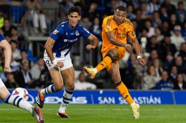 San Sebastian, Spain - September 14, 2024: League match between Real Sociedad and Real Madrid, played in San Sebastian. Kylian Mbappe with the ball. Real Madrid players. clipart