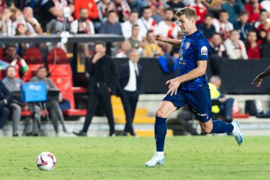 Madrid, Spain - September 22, 2024: League match between Rayo Vallecano and Atletico de Madrid, played in Vallecas. Atletico de Madrid players. Rayo Vallecano players. clipart