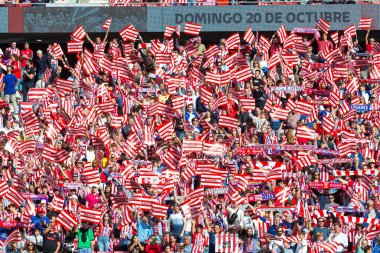 Madrid, Spain - October 20, 2024: League match between Atletico de Madrid and Legans f.c. Atletico players. Legans players. Atletico fans. Players celebrating a goal. clipart