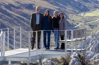 Oviedo, Spain - October 24, 2024: The King and Queen of Spain and their daughters visit the town of Sotres in the Picos de Europa as an exemplary town in 2024. The Princess of Asturias walks through the streets of Sotres. clipart