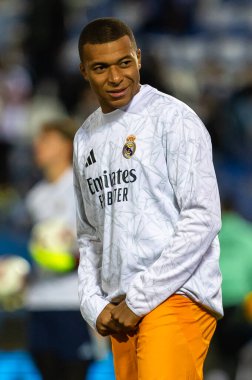 Madrid, Spain - November 24, 2024: League match between Leganes FC and Real Madrid played in Madrid. Real Madrid players. Orange jersey. League 2024 2025. European football champions clipart