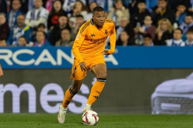 Madrid, Spain - November 24, 2024: League match between Leganes FC and Real Madrid played in Madrid. Real Madrid players. Orange jersey. League 2024 2025. European football champions clipart