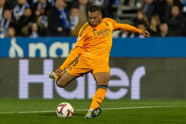 Madrid, Spain - November 24, 2024: League match between Leganes FC and Real Madrid played in Madrid. Real Madrid players. Orange jersey. League 2024 2025. European football champions clipart