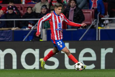 Madrid, Spain - December 11, 2024: Champions League match between Atletico de Madrid and SK Slovamn Bratislava played in Madrid. Atletico de Madrid players. Colchoneros win clipart