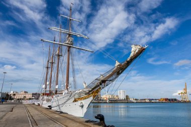 Cadiz, Spain - January 8, 2025: The Princess of Asturias boards the training ship Juan Sebastian El Cano as a naval guard in the port of Cadiz. Spanish military vessel. Four-masted sailing ship. Sailing boat. clipart