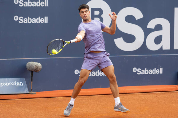 Barcelona, Spain- April 12, 2025: Conde de God tennis tournament held in Barcelona. ATP 500. Tennis competition. Professional tennis players. Tennis courts. Carlos Alcaraz on a dirt track.