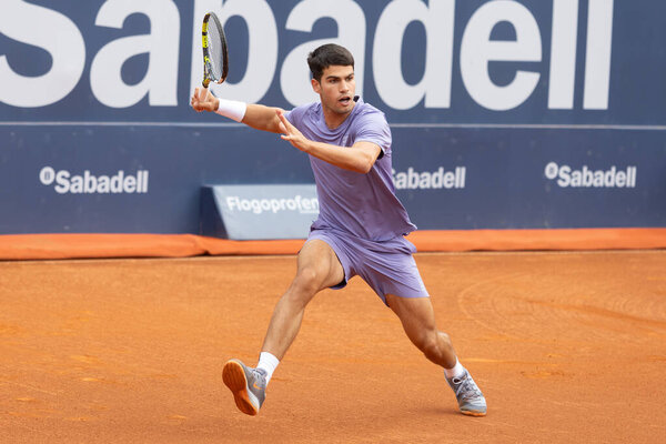 Barcelona, Spain- April 12, 2025: Conde de God tennis tournament held in Barcelona. ATP 500. Tennis competition. Professional tennis players. Tennis courts. Carlos Alcaraz on a dirt track.