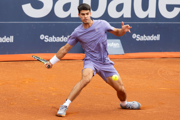 Barcelona, Spain- April 12, 2025: Conde de God tennis tournament held in Barcelona. ATP 500. Tennis competition. Professional tennis players. Tennis courts. Carlos Alcaraz on a dirt track.