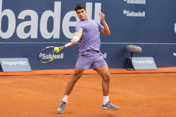 Barcelona, Spain- April 12, 2025: Conde de God tennis tournament held in Barcelona. ATP 500. Tennis competition. Professional tennis players. Tennis courts. Carlos Alcaraz on a dirt track.