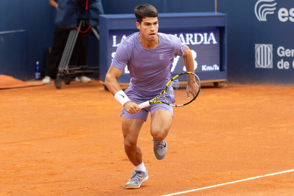 Barcelona, Spain- April 12, 2025: Conde de God tennis tournament held in Barcelona. ATP 500. Tennis competition. Professional tennis players. Tennis courts. Carlos Alcaraz on a dirt track.