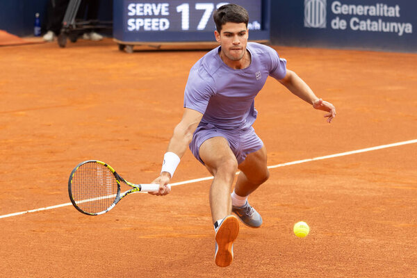 Barcelona, Spain- April 12, 2025: Conde de God tennis tournament held in Barcelona. ATP 500. Tennis competition. Professional tennis players. Tennis courts. Carlos Alcaraz on a dirt track.
