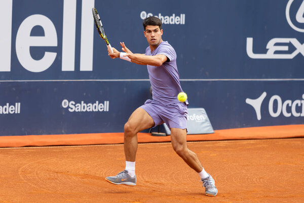 Barcelona, Spain- April 12, 2025: Conde de God tennis tournament held in Barcelona. ATP 500. Tennis competition. Professional tennis players. Tennis courts. Carlos Alcaraz on a dirt track.