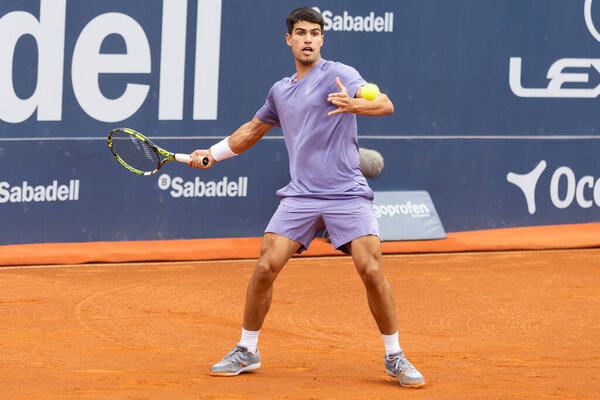 Barcelona, Spain- April 12, 2025: Conde de God tennis tournament held in Barcelona. ATP 500. Tennis competition. Professional tennis players. Tennis courts. Carlos Alcaraz on a dirt track.