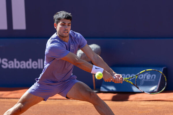 Barcelona, Spain- April 12, 2025: Conde de God tennis tournament held in Barcelona. ATP 500. Tennis competition. Professional tennis players. Tennis courts. Carlos Alcaraz on a dirt track.