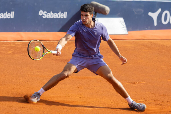 Barcelona, Spain- April 12, 2025: Conde de God tennis tournament held in Barcelona. ATP 500. Tennis competition. Professional tennis players. Tennis courts. Carlos Alcaraz on a dirt track.