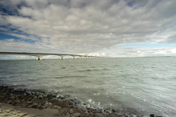 stock image Cloudy evening at te Zeelandbridge, Zeelandbrug, Zierikzee, The Netherlands.