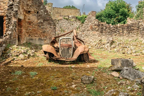 Stock image Old rusty cars left behind in Oradour-sur-Gllane, France.