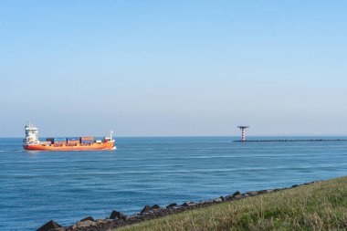 October 25, 2024. Maasvlakte Rotterdam, The Netherlands. Cargo Ships coming into the Harbour of Rotterdam. clipart